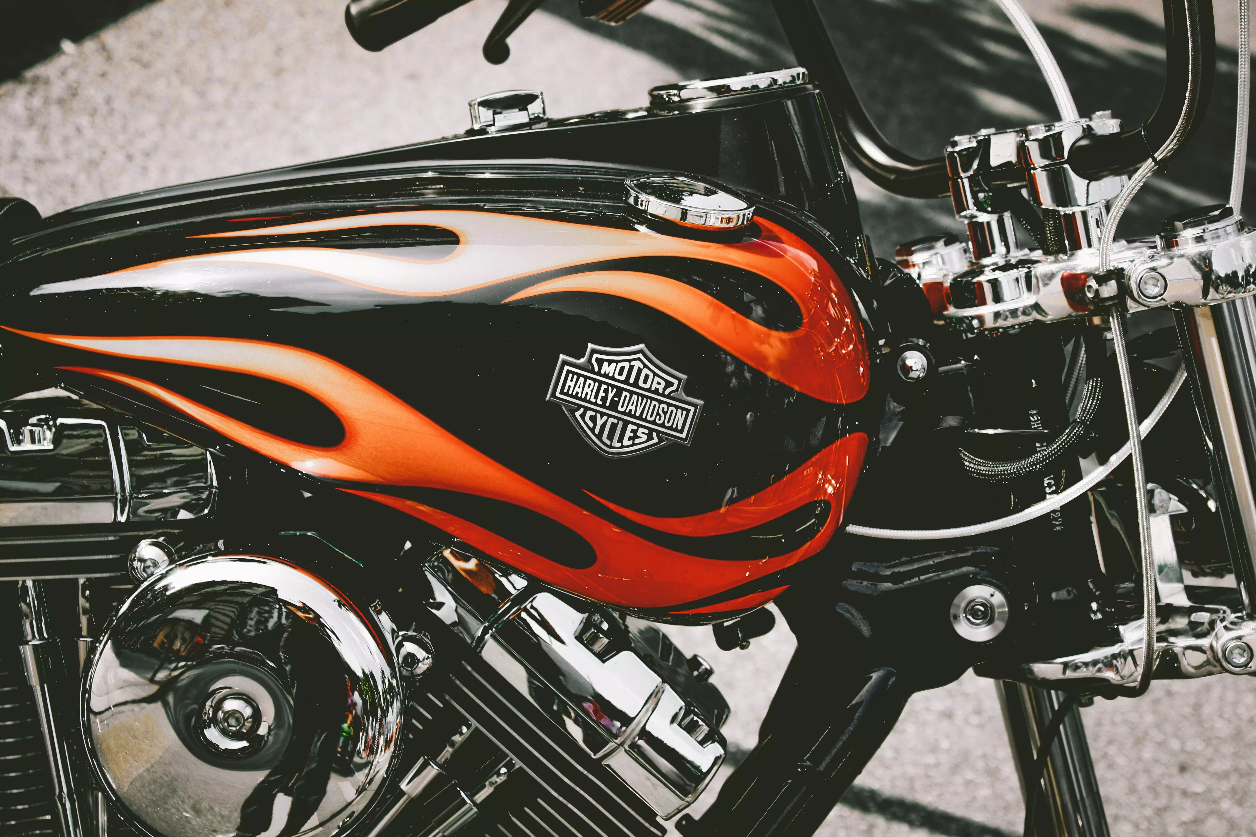AnyConv.com__harley davidson motorcycle with black and orange fuel tank and chrome engine AnyConv.com__harley davidson motorcycle with black and orange fuel tank and chrome engine
